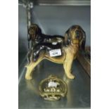 A MELLA WARE PORCELAIN STANDING DOG, ANOTHER SIMILAR AND A JOHN PEEL BRASS DOOR KNOCKER (3)