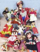 TWENTY, MAINLY SOUVENIR, COSTUME DOLLS, also including 'Merlin' doll on stand and a 'Jays' peddler