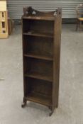 A WOODEN BOOKCASE