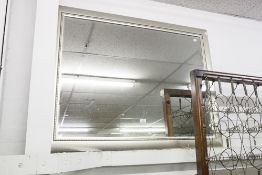 A LARGE RECTANGULAR BEVELLED EDGE MIRROR IN SILVER WOODEN FRAME