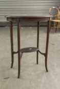 A MAHOGANY OVAL OCCASIONAL TABLE, RAISED ON SLENDER LEGS