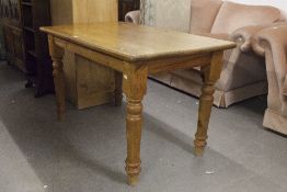 A PINE OBLONG KITCHEN TABLE, ON TURNED LEGS