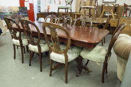 A REPRODUCTION DINING TABLE ON TWIN PEDESTAL SUPPORTS WITH REEDED OUTSWEPT SUPPORTS AND A SET OF