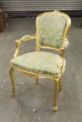 A LOUIS XVI STYLE GILT FRAMED ARMCHAIR, WITH PAD BACK, SEAT AND ARMS, GREEN AND GILT PATTERNED