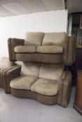 A PAIR OF TWO SEATER SETTEE'S IN BROWN HIDE AND A MATCHING ARMCHAIR