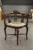 AN EDWARDIAN MARQUETRY INLAID MAHOGANY CORNER ARMCHAIR