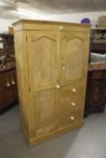 A SMALL PINE COMBINATION WARDROBE, WITH CUPBOARD AND THREE DRAWERS