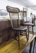 A SMALL HARDWOOD CHAIR WITH ROUND PANEL SEAT