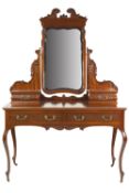 LATE NINETEENTH/EARLY TWENTIETH CENTURY CARVED MAHOGANY DRESSING TABLE, the rounded oblong top