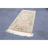 HEAVY QUALITY WASHED CHINESE ALL-WOOL RUG with Aubusson embossed floral and off-white centre