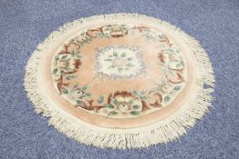 HAND-KNOTTED WASHED CHINESE OVAL RUG of Aubusson design with oval centre floral medallion on a plain