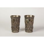 PAIR OF ELECTRO FORMED BEAKERS, marked H & A, of typical form, decorated with rustic figures in