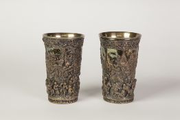 PAIR OF ELECTRO FORMED BEAKERS, marked H & A, of typical form, decorated with rustic figures in