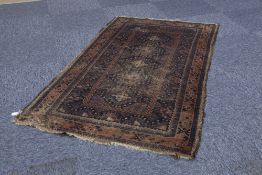 SHIRAZ SEMI ANTIQUE PERSIAN RUG, with five section pole medallion in brown and white on a black