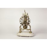 A VICTORIAN BRASS SKELETON CLOCK with single train chain fusee movement, on a stepped alabaster