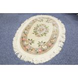 WASHED CHINESE ALL-WOOL OVAL RUG of Aubusson with embossed floral oval centre medallion and green