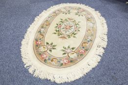 WASHED CHINESE ALL-WOOL OVAL RUG of Aubusson with embossed floral oval centre medallion and green