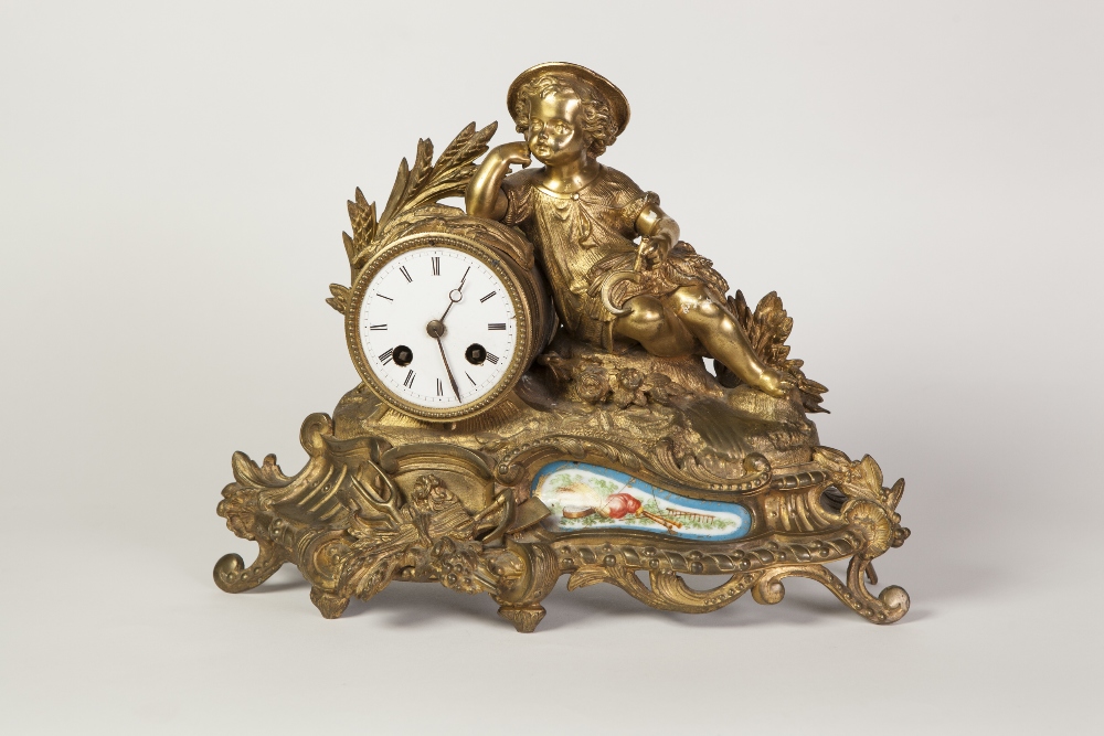 LATE NINETEENTH CENTURY FRENCH GILT METAL AND PORCELAIN MOUNTED FIGURAL MANTEL CLOCK, the 3 1/4"