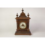 EARLY TWENTIETH CENTURY H.A.C., GERMANY CARVED WALNUTWOOD MANTEL CLOCK, the 4" Roman dial with