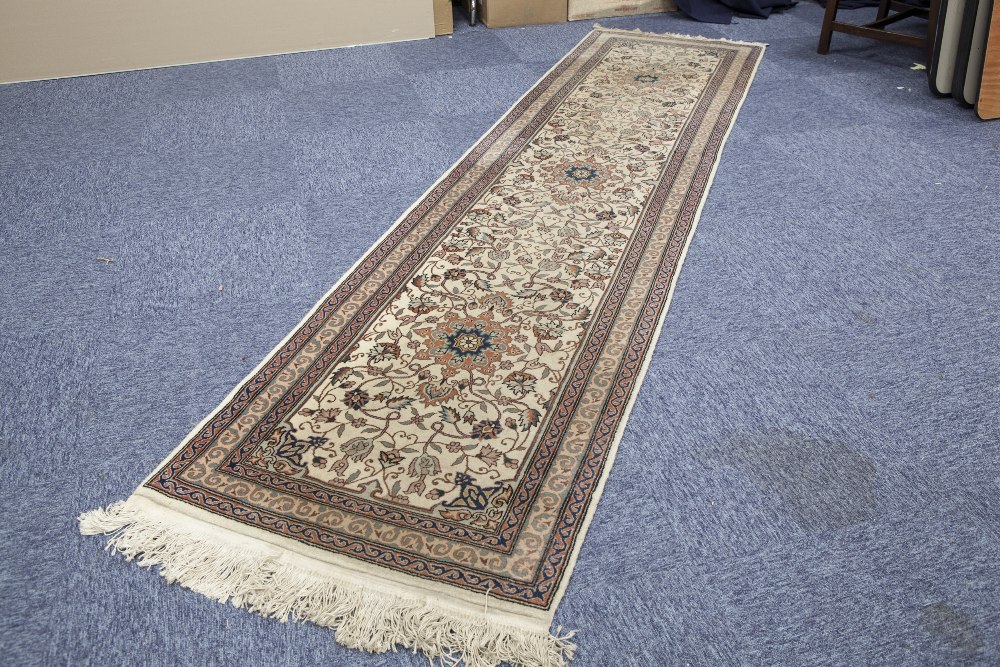 PERSIAN STYLE MACHINE WOVEN WOOL PILE RUNNER, with two circular medallions on an off white field