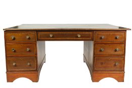 EDWARDIAN MAHOGANY AND SATINWOOD BANDED PARTNERS DESK, the crossbanded oblong top with reeded edge