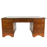 EDWARDIAN MAHOGANY AND SATINWOOD BANDED PARTNERS DESK, the crossbanded oblong top with reeded edge