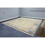 A NEPALESE PLAIN HAND WOVEN ALL-WOOL CARPET, with plain fawn field, the broad border with muted