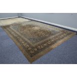 BORDERED WILTON CARPET OF PERSIAN DESIGN, with large circular centre medallion within an oval