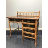 LATE 19th CENTURY BAMBOO SINGLE PEDESTAL DESK with five drawers, having spandled gallery back,