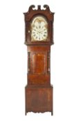 EARLY NINETEENTH CENTURY FLAME CUT AND CROSSBANDED MAHOGANY LONG CASE CLOCK, with rolling moonphase,