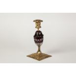 LATE NINETEENTH/EARLY TWENTIETH CENTURY EMBOSSED GILT BRASS AND FLASH CUT AMETHYST GLASS