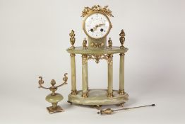 EARLY TWENTIETH CENTURY FRENCH GILT METAL AND GREEN ONYX PORTICO MANTEL CLOCK, the 4" enamelled