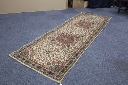 EASTERN RUNNER with triple circular medallion pattern and all over trailing floral and foliate