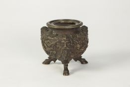 EMBOSSED BRONZE GLOBULAR BOWL, the exterior decorated with fruiting vines and three satyr mask