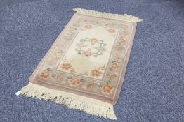 THREE HEAVY QUALITY HAND-KNOTTED WASHED CHINESE OBLONG RUGS of embossed Aubusson design, one with an