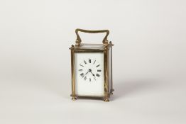 LATE NINETEENTH/EARLY TWENTIETH CENTURY BRASS CASED CARRIAGE CLOCK, of typical form with top