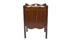 GEORGIAN MAHOGANY BEDSIDE CABINET, the oblong top with cut out handles to the wavy gallery, above