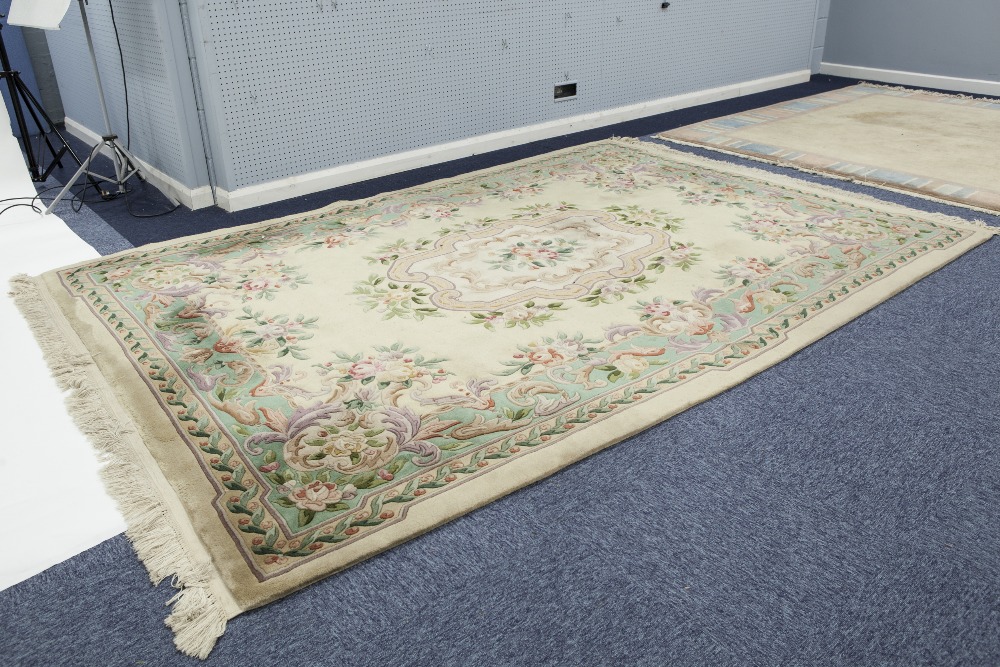 GOOD QUALITY EMBOSSED WASHED CHINESE CARPET OF AUBUSSON DESIGN with large centre floral oblong panel