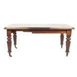 VICTORIAN MAHOGANY WIND-OUT EXTENDING DINING TABLE, with extra leaf, the rounded oblong top with