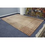 NEPALESE SILK AND WOOL PILE HAND WOVEN CARPET, with plain light brown field, broad horizontal