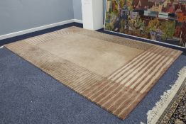 NEPALESE SILK AND WOOL PILE HAND WOVEN CARPET, with plain light brown field, broad horizontal