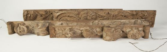 PAIR OF ANTIQUE FLEMISH CARVED OAK PANELS OR CAPPING PIECES, each as a mask capped corbel above