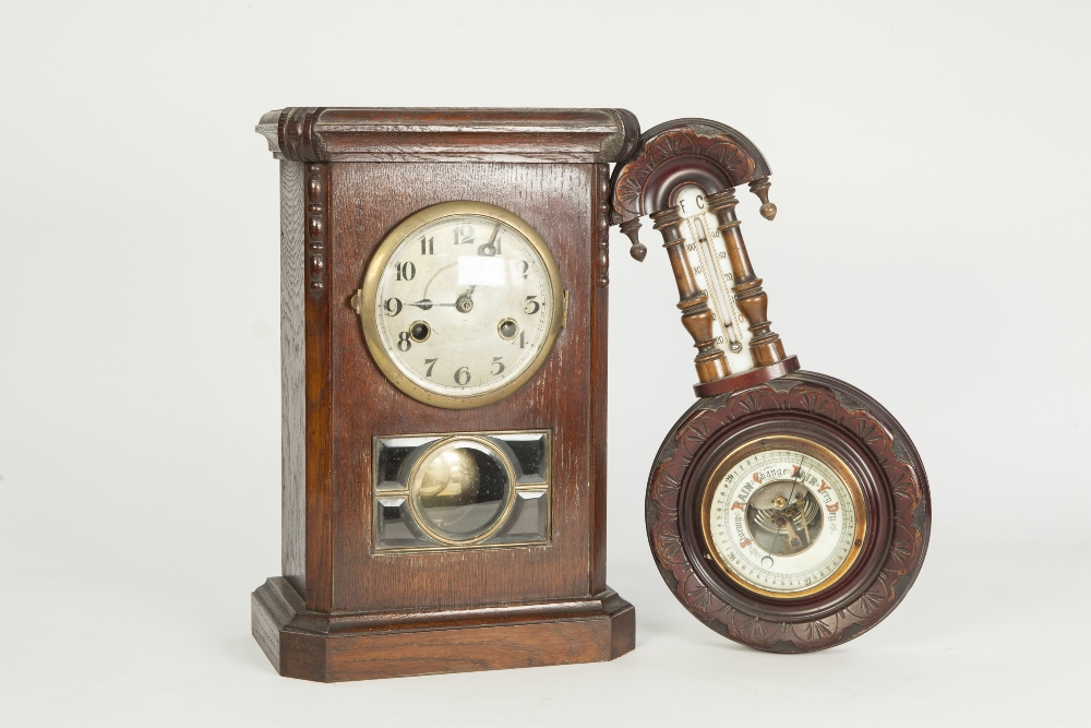 1930's CARVED OAK MANTEL CLOCK, with silvered 4 1/2" Arabic dial above a bevel glazed panel of