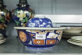 IMARI PORCELAIN BOWL, 10" DIAMETER AND A NANKIN BLUE AND WHITE GINGER JAR, PAINTED WITH PRUNUS