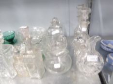 A PAIR OF VICTORIAN GLASS MALLET SHAPED DECANTERS AND A CUT GLASS CLARET JUG (3)