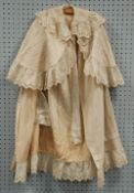 LADY'S EDWARDIAN CREAM AND FLORAL BRODERIE ANGLAISE FULL LENGTH EVENING CLOAK, together with a
