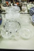 THREE LARGE CUT GLASS FRUIT BOWLS, A CUT GLASS CAKE PLATE, A PEDESTAL CAKE PLATE, A PEDESTAL CAKE