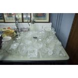 QUANTITY OF CUT AND OTHER GLASS WARES INCLUDING; BOWLS, VASES, CANDLESTICKS, ASHTRAYS ETC.......