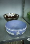 A POTTERY SILVER LUSTRE FRUIT BOWL AND A TWENTIETH CENTURY WEDGWOOD PALE BLUE AND WHITE FRUIT