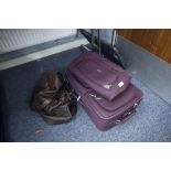 'PIERRE CARDIN' MAROON CANVAS CABIN SUITCASE, WITH EXTENDING HANDLE AND WHEELS, A MATCHING SMALL